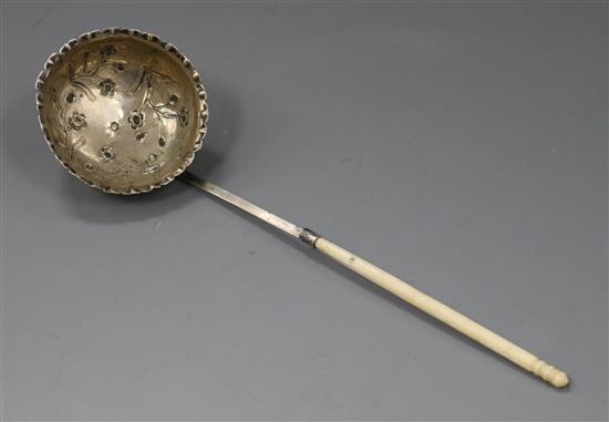 A continental white metal ladle, with embossed bowl and turned handle, 22cm.